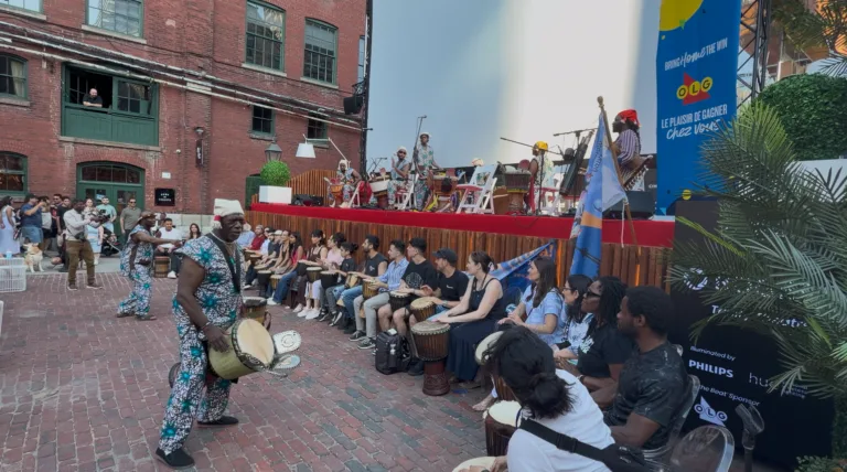 Drum circle with the audience in the Distillery District