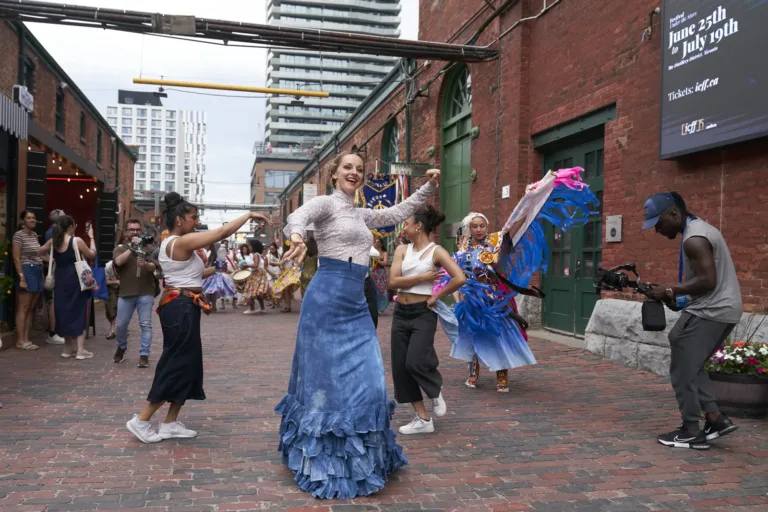 Dancer in a blue skirt in a Distillery lane