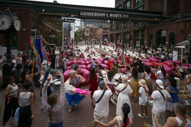 Crowd under the Gooderham & Worts sign