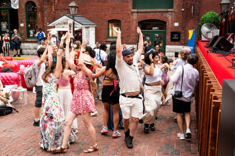 Crowd dancing with hands up